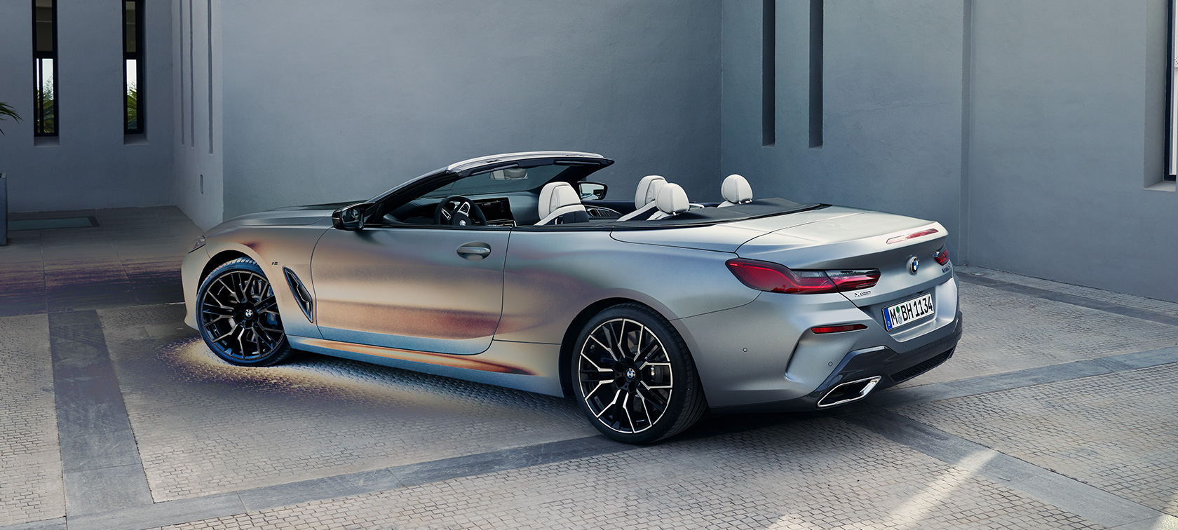 BMW M850i xDrive Convertible G14 LCI Facelift 2022 BMW Individual Frozen Pure Grey metallic three-quarter rear view standing